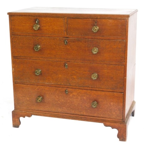 A George III oak chest, of two short and three graduated drawers, with pressed brass knob handles, and bracket feet, 100cm wide.