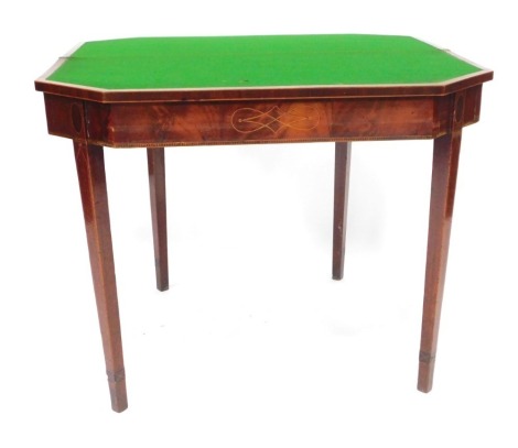 A George III mahogany card table, with canted rectangular folding top, cross banded and satinwood strung, on square taper legs, 92cm wide.