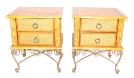 A pair of Chinese bedside tables, with boarded tops, each with raffia drawers and gilt wrought metal scroll legs, 56cm wide.