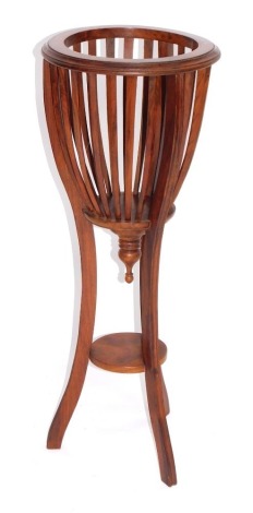 A brass inlaid rosewood jardiniere stand, with slatted side and under shelf, 91cm high.