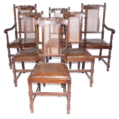 A set of six Carolean style barley twist oak dining chairs, with caned backs and drop in seats. (1 carver subject to wood worm)