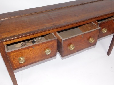 A 19thC cross banded oak and mahogany dresser base, with three drawers, 85cm high, 156cm wide, 54cm deep. - 2