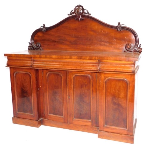 A Victorian mahogany sideboard, with scroll back, three cushion drawers and four door inverted breakfront base on plinth, 153cm wide.