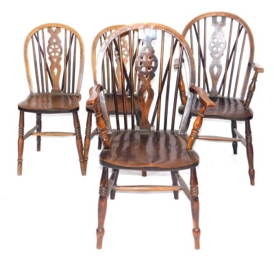 A set of four ash and elm Windsor chairs, including two carvers, each having wheel backs and triple ring turned forelegs.