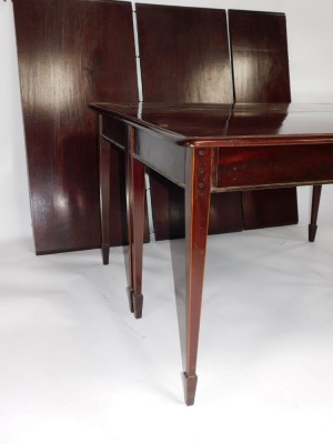 An Edwardian mahogany dining table, with rectangular ends on square taper legs with spayed feet, 131cm wide, 122cm minimum and two further leaves of a total 115cm extension. - 2