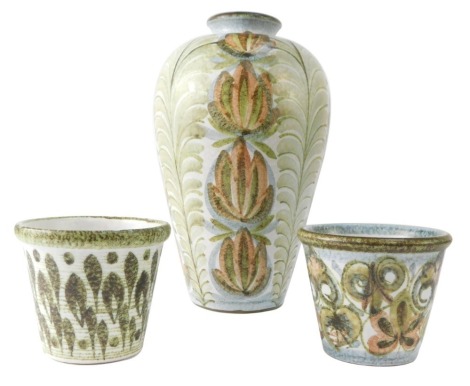 Three Denby stoneware vases, comprising baluster vase and two planters, each with mottled floral design, 31cm and 12cm. (3)