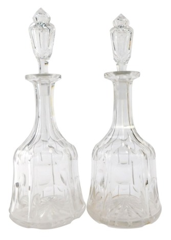 A pair of 19thC pressed glass mallet shaped decanters, with a bubble decoration, 33cm high.