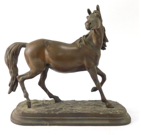 A cast figure of a galloping horse, on circular foot, 21cm high, 22cm wide.