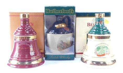 Bells and Rutherford's Scotch Whiskey decanters, comprising Bells Christmas 1998 and Christmas 1999, in presentation box, and a Rutherfords Aged 12 Years Grouse ceramic whiskey bottle. (3)