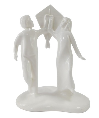 A Royal Doulton Images figure group, Care Free, a girl and boy carrying kite, 19cm high.