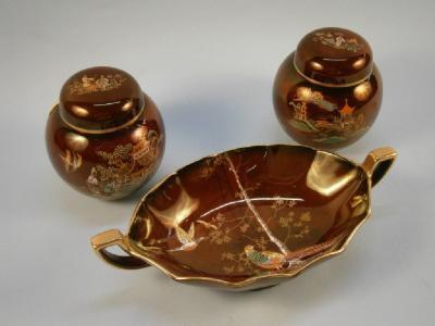 A Crown Devon red lustre ware two-handled dish decorated with pheasants