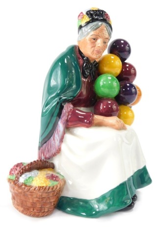 A Royal Doulton The Old Balloon Seller figure, 19cm high.