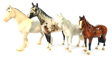 Four horse ornaments, comprising three modern John Beswick horses, and a Royal Doulton dapple horse, the largest 19cm high. (4)