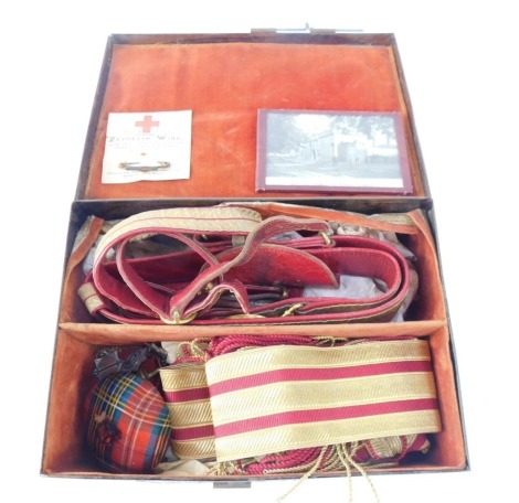 Masonic regalia, belts, neck scarf and accessories, in a metal tin case, stamped J B Johnson of London.