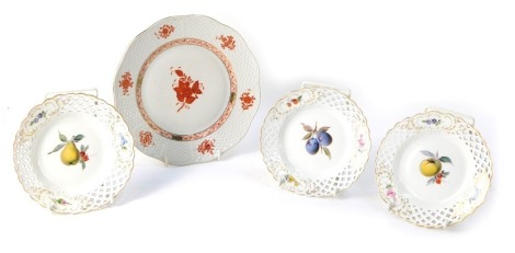 Four cabinet plates, comprising three Meissen ribbon plates, 15cm diameter, and a Dresden 1955 cabinet plate, with fluted and orange painted border, 21cm diameter. (4)