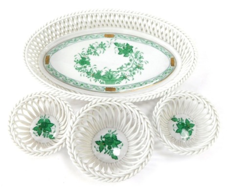Herend of Hungary decorative porcelain baskets, comprising an oval basket and three smaller baskets, each painted with green in the Apponyi or Chinese bouquet pattern decoration, the largest 28cm diameter. (4)