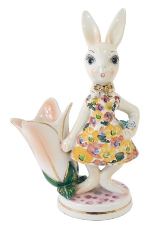 An Italian porcelain rabbit figure group, of a rabbit in floral dress with tulip flower vase, 25cm high.