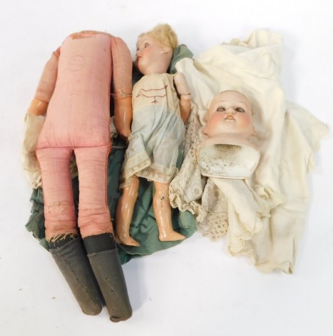 A German Armand Marseilles bisque headed doll, with wooden painted limbs, in blue dress, together with a Pedigree doll, boxed. (2)