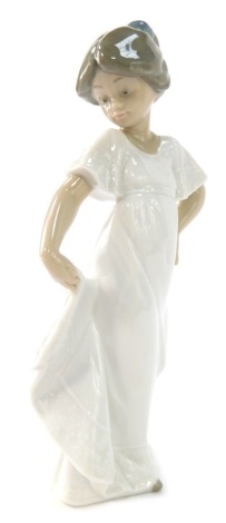 A Nao porcelain figure of a girl, 22cm high.