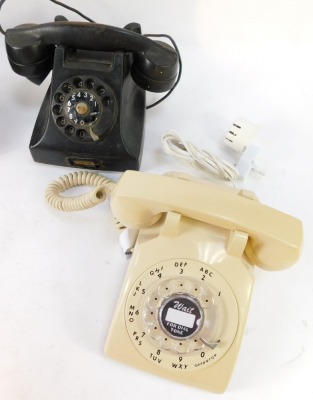 Four Bakelite and plastic telephones, two black, one cream and one grey. (4) - 6