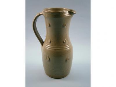 A Studio Pottery jug by Ray Finch of Winchcombe with a brown mottled glaze