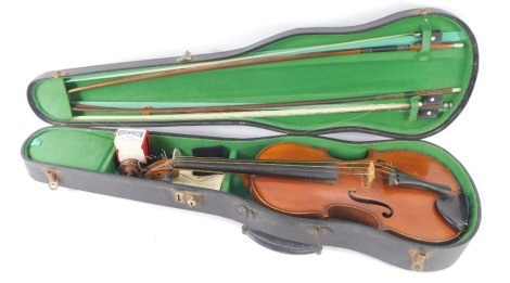 A Geronimo Barnabetti of Paris violin, with two piece back and three bows, various spare pegs, in fitted carry case, 57cm long,