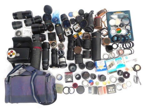 Camera and optics equipment, to include photography bag and lens cases, a Mya Opteka 72mm lens, a Minolta 70-210 lens, a Sigma 100mm lens, Sigma Zoom 80mm lens, Minolta AF28-80 lens, Minolta 35-70mm lens, Photography Course guide, various lens caps and ca