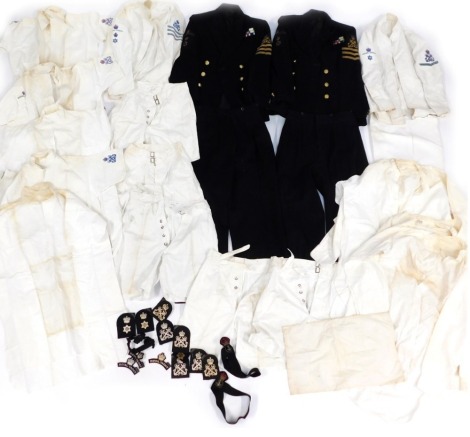 A group of Royal Yacht Britannia uniforms, overcoats, trousers and badges. (a quantity)