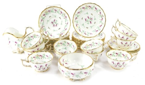 A Victorian porcelain tea service, comprising twelve cups and saucers, side plates, milk jug and sugar bowl.