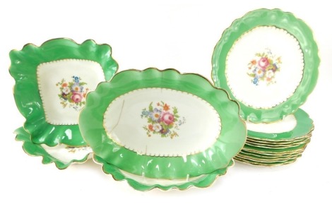 A George Jones Crescent 20thC porcelain part service, comprising three oval serving plates, two square set serving plates and twelve medium plates.