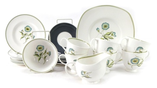 A Susie Cooper part tea service decorated in the Blue Bell pattern, comprising six cups and saucers, milk jug, sugar bowl, six side plates, and a cake plate.