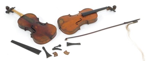 Two violins, each with two piece back , one bearing Vuillaume label and a bow. (AF)