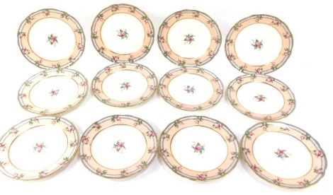 A set of twelve Aynsley dessert plates, each with a gilt rim and border, decorated with roses on a pink outer ground and cream centre, 22cm diameter.