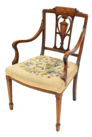 An Edwardian marquetry carver chair, with urnular splat, inlaid with scrolling decoration and tapestry seat.