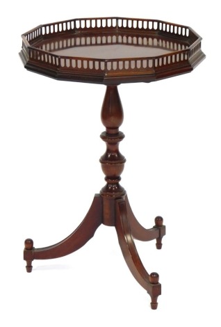 A mahogany occasional table, in George III style, the dodecagon pierced gallery above a turned column and splayed legs, 64cm high, 44cm wide.