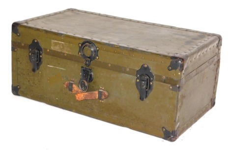 A green painted canvas and metal cabin trunk, with single leather handle, 77cm wide. (AF).