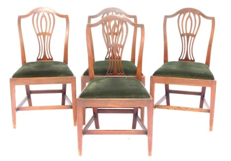 A set of four mahogany dining chairs, in George III style, each with a pierced vase shaped splat, a drop in seat, on square tapering legs, with H stretcher.