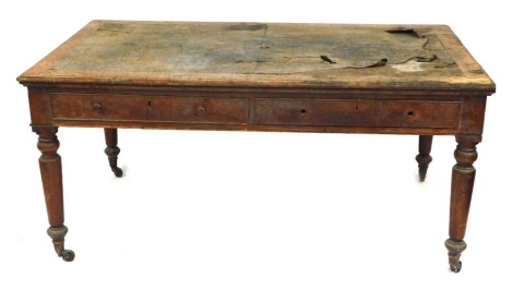 An early Victorian oak writing table, the rectangular top with a cross banded border and a moulded edge, above two frieze drawers, on turned legs with castors, 77cm high, 165cm wide, 98cm deep. (AF)