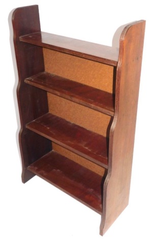 An Edwardian walnut waterfall open bookcase, with reeded sides, 71cm wide.