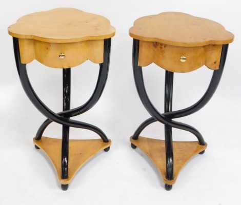 A pair of Art Deco style birds eye maple birch veneer and ebonised bedside tables, with cloud shaped top and drawer, each 72cm high.