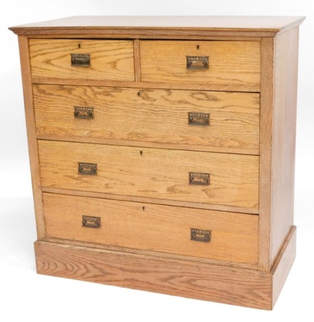 An Edwardian oak chest, of two short and three long graduated drawers, with brass handles and plinth base, 105cm high, 107cm wide, 50cm deep.