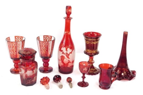 A group of 19thC Bohemian ruby flashed glass ware, comprising a trumpet vase, pair of goblets, decanter and stopper, various stoppers, etc. (a quantity)