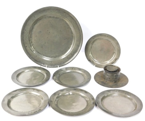 A group of 18thC and later pewter, comprising an inkwell, large charger, 36cm diameter, stamped B A, and a set of six small plates, 22cm diameter, stamped B A. (8)