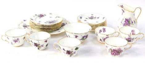 A Hammerley's China part tea service in the Victorian Violets pattern, comprising cake plate, six saucers, six tea cups, six side plates, milk jug and sugar bowl.