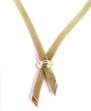 A dress necklace, with cross over design, gold coloured with modern clasp, 46cm long.