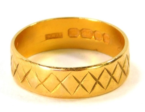 A 22ct gold wedding band, of cross hatch design, London 2014, size S, 4.8g all in.