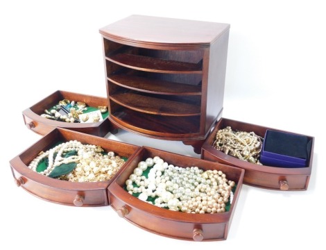 A mahogany miniature jewellery chest, of four drawers, and contents comprising plated pearl jewellery, cultured pearl necklaces, clip-on earrings, etc. (1 box)