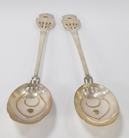 A pair of silver plated Art Nouveau serving spoons, each with pierced Art Nouveau top and bowl, stamped EP.