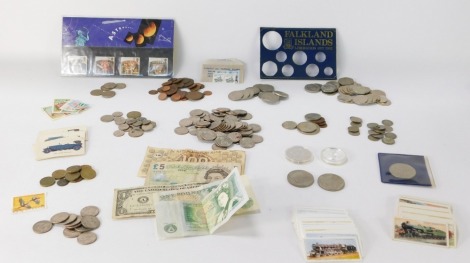 Coins, bank notes and stamps, comprising pennies and halfpennies, United States of America Quarter Dollars, Falklands Islands Liberation Set cardboard sleeve, small group of Falkland Islands coins, sixpence pieces, 5p pieces, 10p pieces, collector's 50p p