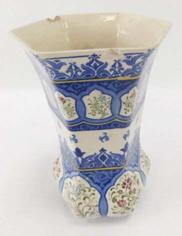 A Royal Doulton Islamis style vase, on a blue and white ground, with floral detail, 23cm high. (AF)